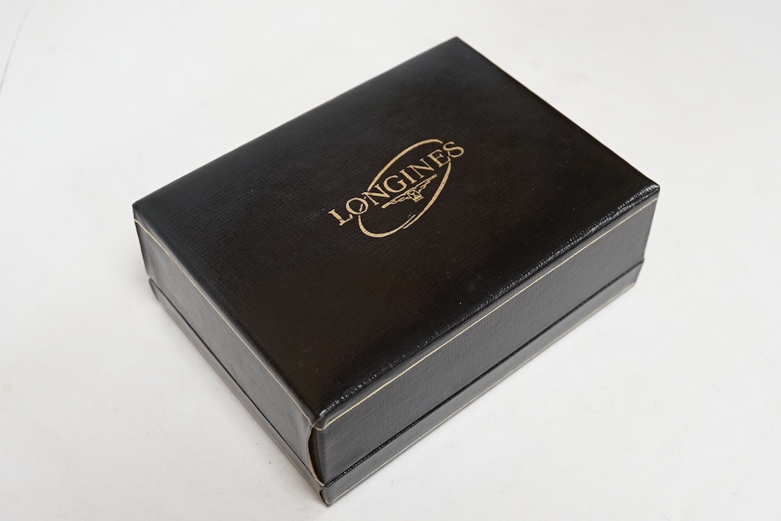 A lady's early 1970's 9ct gold Longines manual wind wrist watch, on an associated 9ct gold bracelet, gross weight 38 grams, with Longines box and pamphlet.